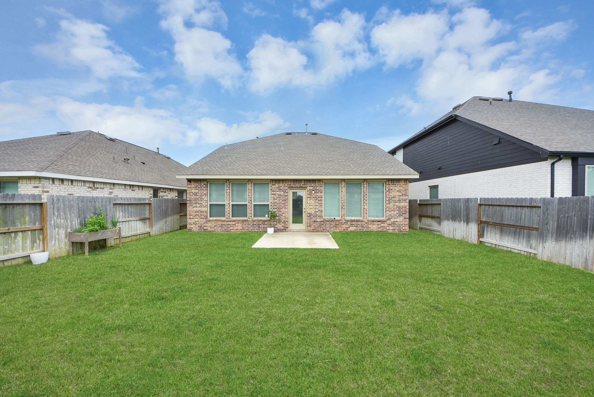 Private fenced backyard at 4946 Sky Bluff Dr